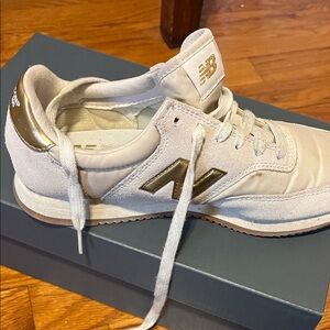New Balance Cream Sneakers with Gold Accents
